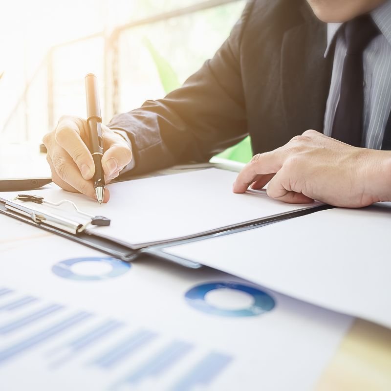 Accountant reviewing financial documents and business reports